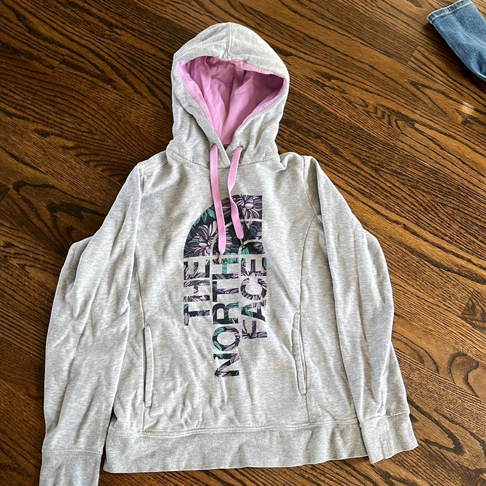 light grey north face sweatshirt.